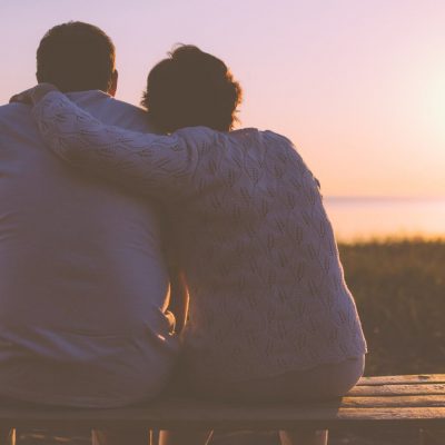 old couple looking at sunset